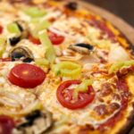 Laktase-Tabletten-zur-Pizza-Essen-Verdauung-unterstützen